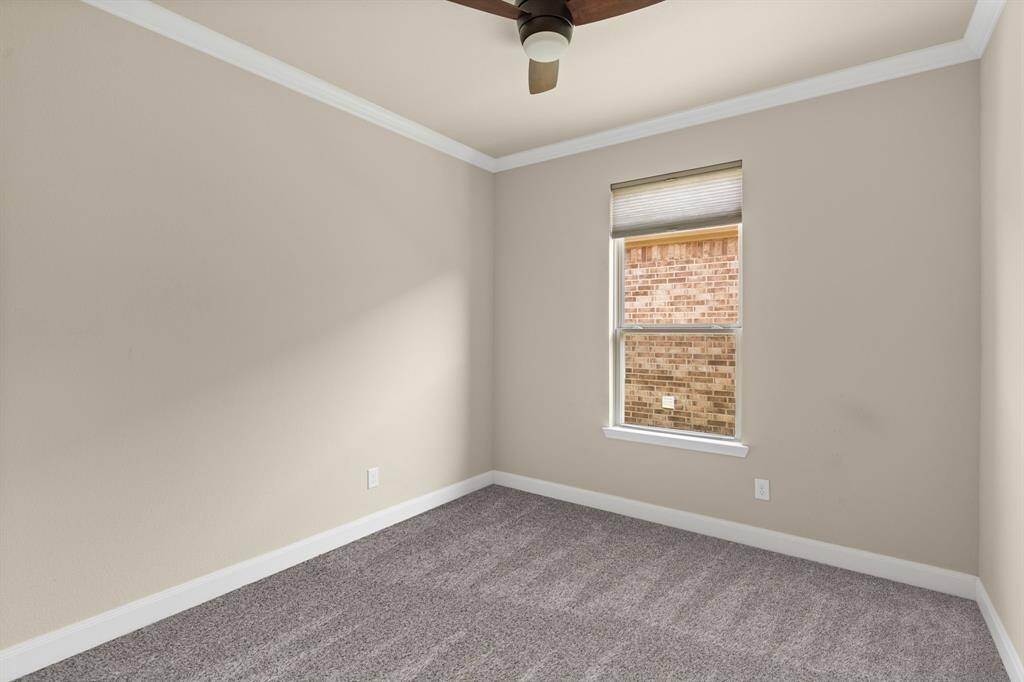 Glistening French doors open into the study/flex room, offering a stylish and private space for work, creativity, or relaxation.