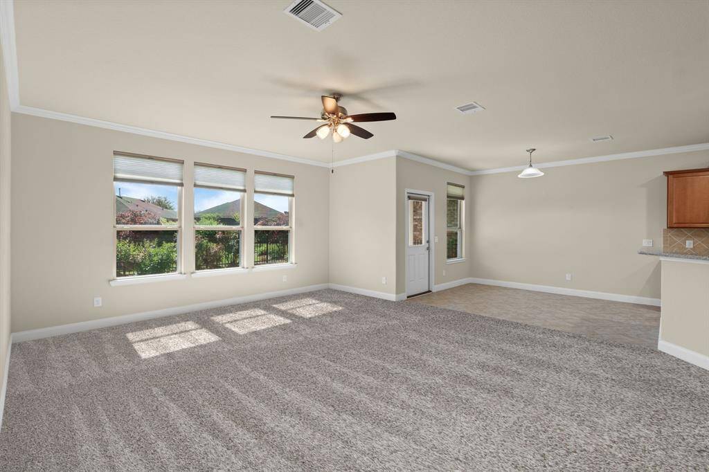 This cozy spot between the Gathering Room and back patio is perfect for a dining area—a round table fits just right! Or, tuck a table against the wall to open up the space while keeping it functional and stylish.