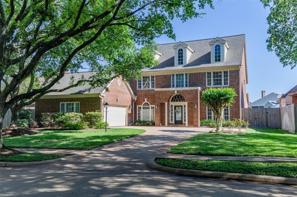 Lovely Exterior Featuring Large Windows and a Symmetrical Design.