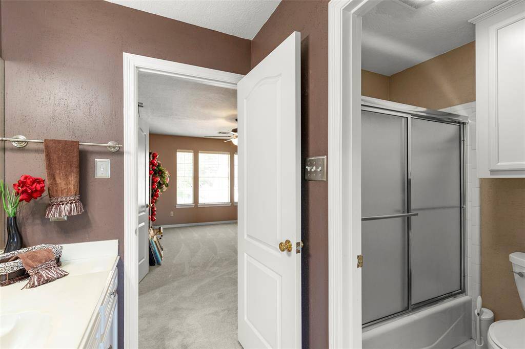 Large Full Bathroom with a Sliding Door Shower/Tub Combo