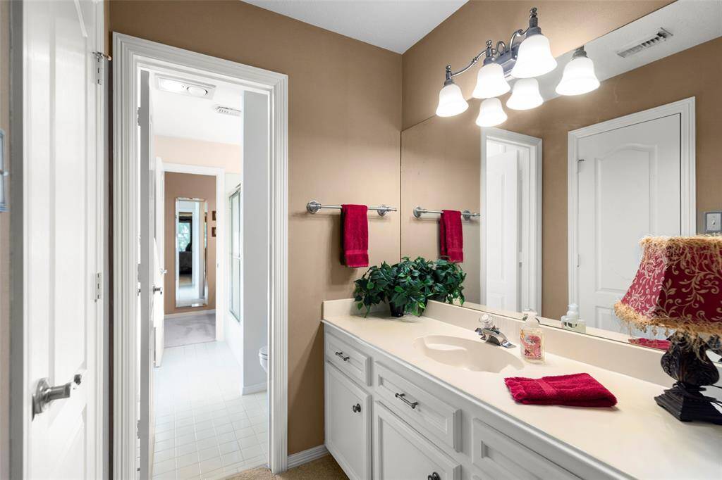 Convenient Bathroom with Tons of Cabinetry for Storage and Counter Space