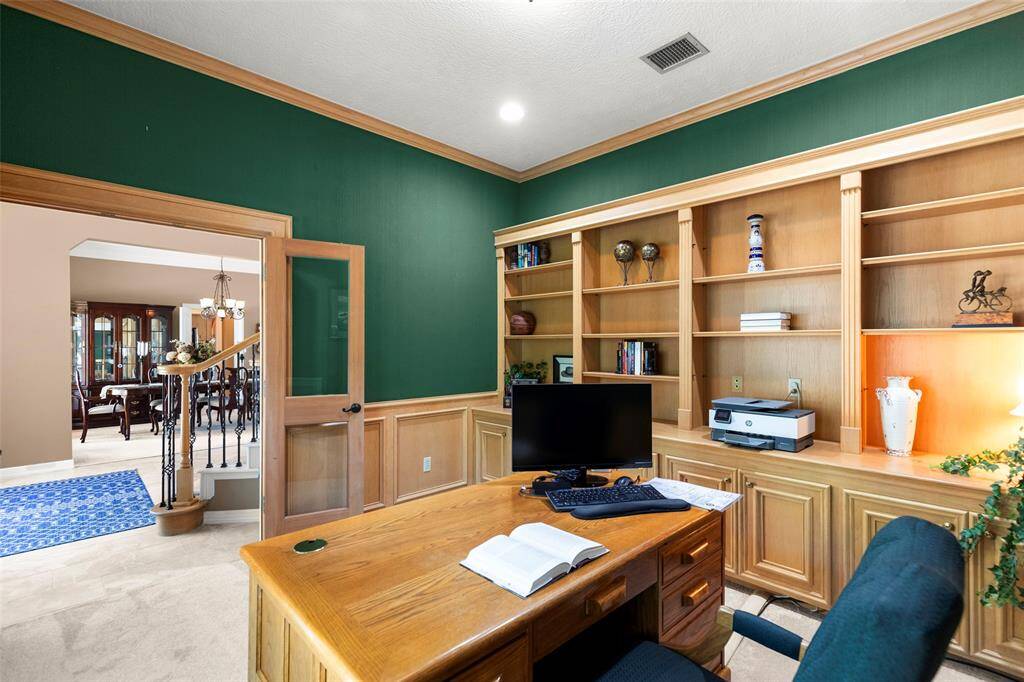 French Doors Open to a Spacious Foyer and View to the Dining Area.