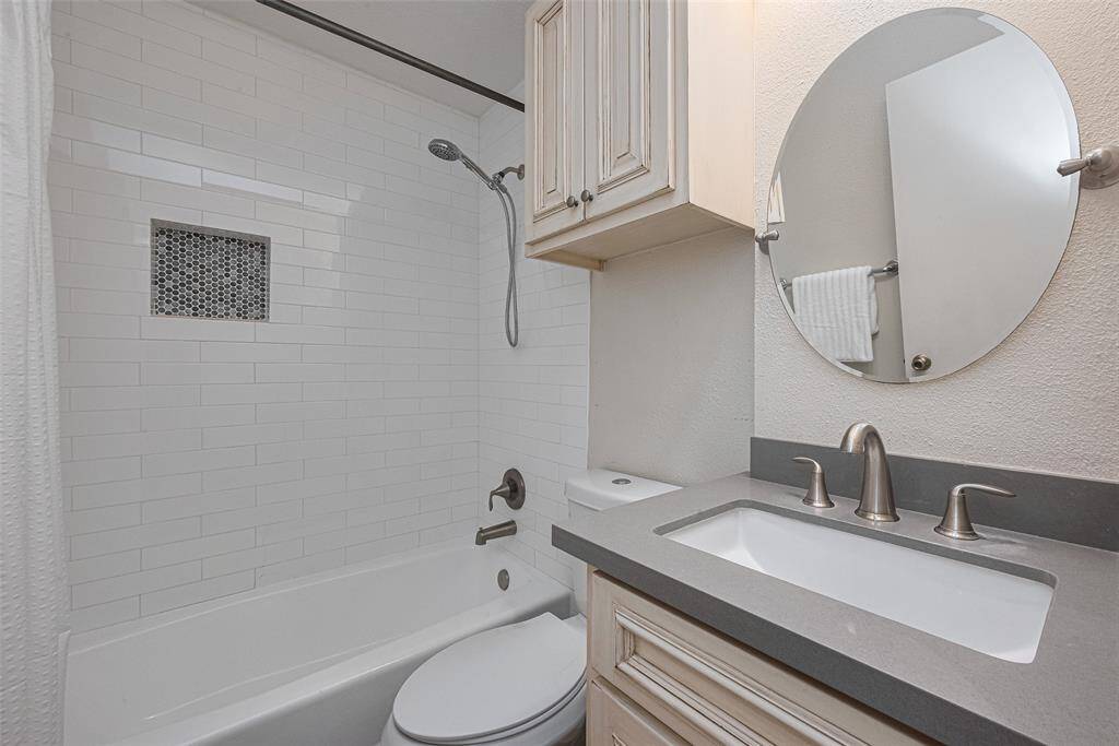 Secondary Bathroom. Tub shower combo. Updated wtih Quartz counertops. Decorative mirror and subway tile with recessed shelf for convience.