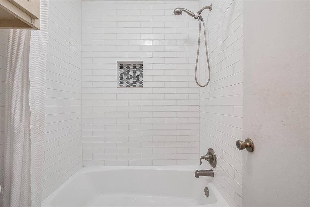 Tub Shower combo.Subway Tile and recessed shelf wtih decorative tile for convience.