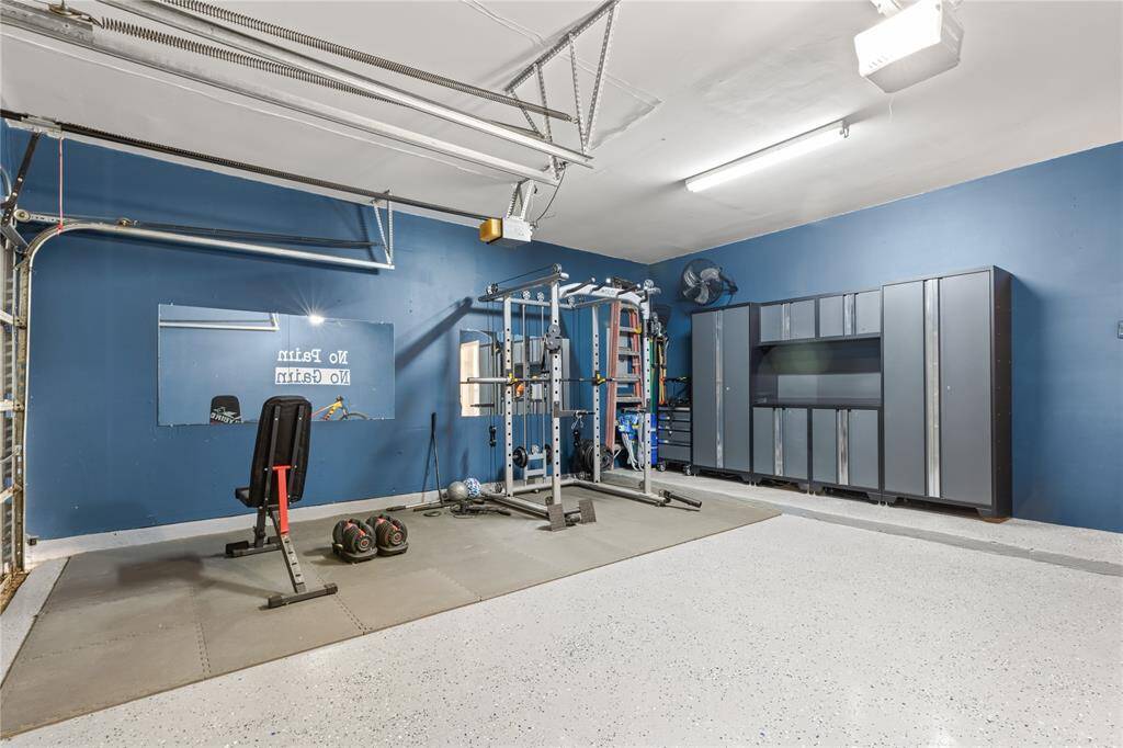 Nicely finished garage that is currently being used as a home gym