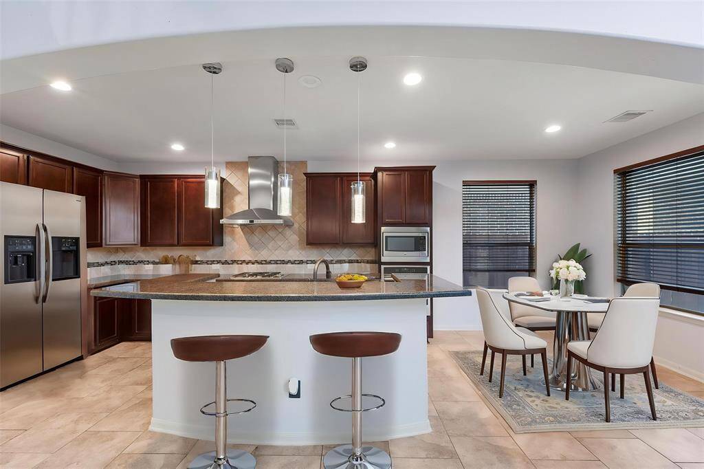 Kitchen is Virtually staged.