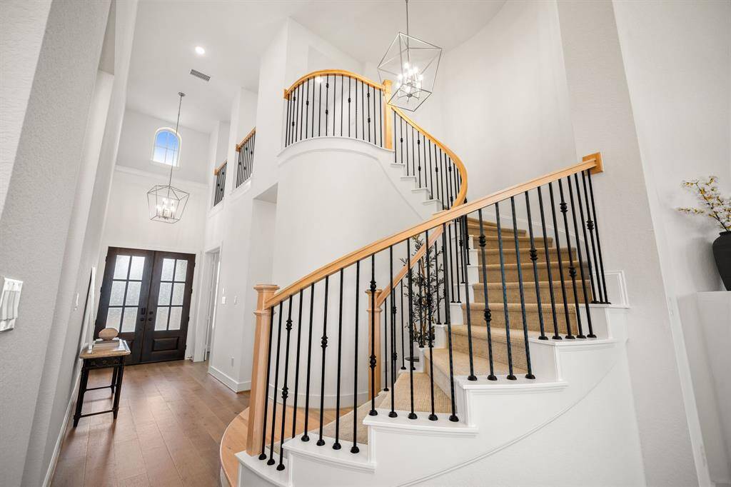Spiral staircase leading to a huge gameroom upstairs.
