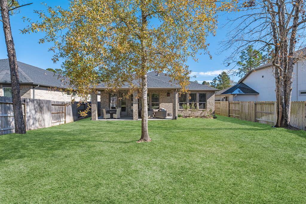 This photo highlights this home's deep yard without neighbors being too close. This area of the community is close to the clubhouse too.