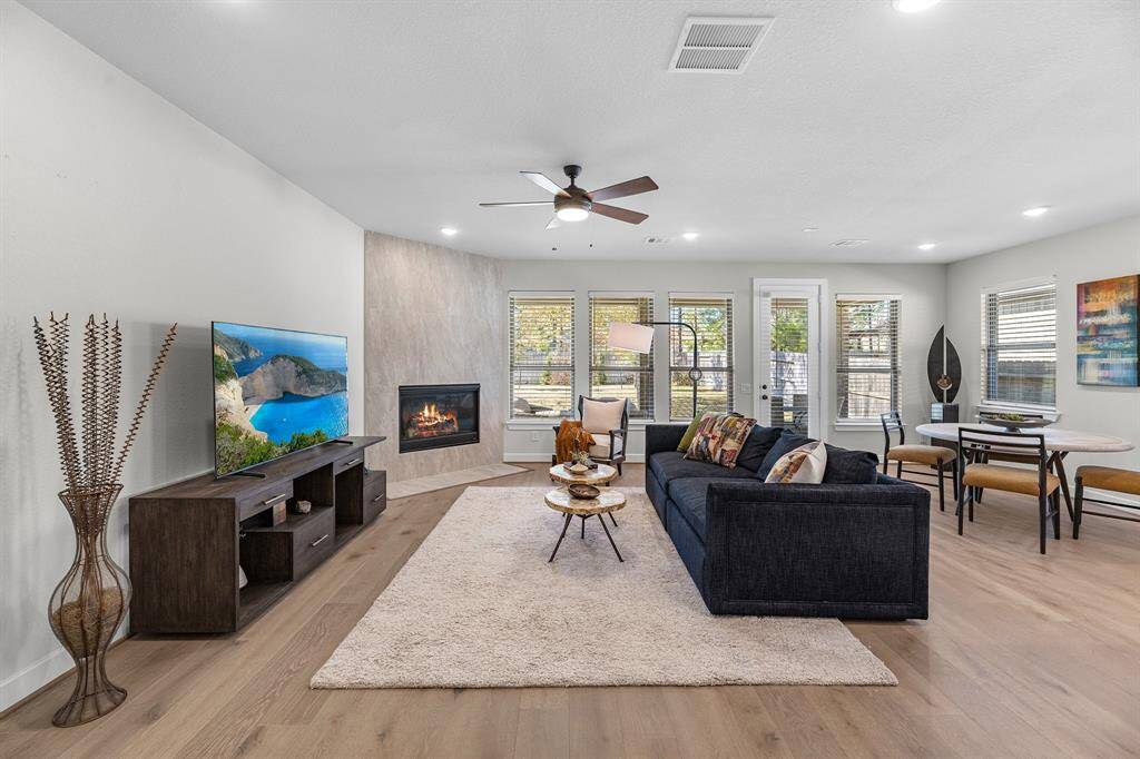 Beautiful front entry welcomes you home. The warm wood floors are throughout the home except in the wet rooms and bedrooms. 2 bedrooms are upfront to the right with a full bathroom in between. You can see all the way through the home to the beautiful backyard too