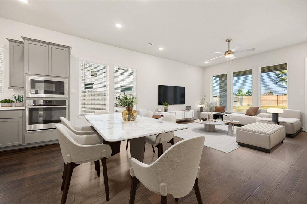 Make memories gathered around the table with your family and friends! This dining room features high ceilings, large windows, wood-like floors and a great view of the ktichen and living room. *Virtually Staged