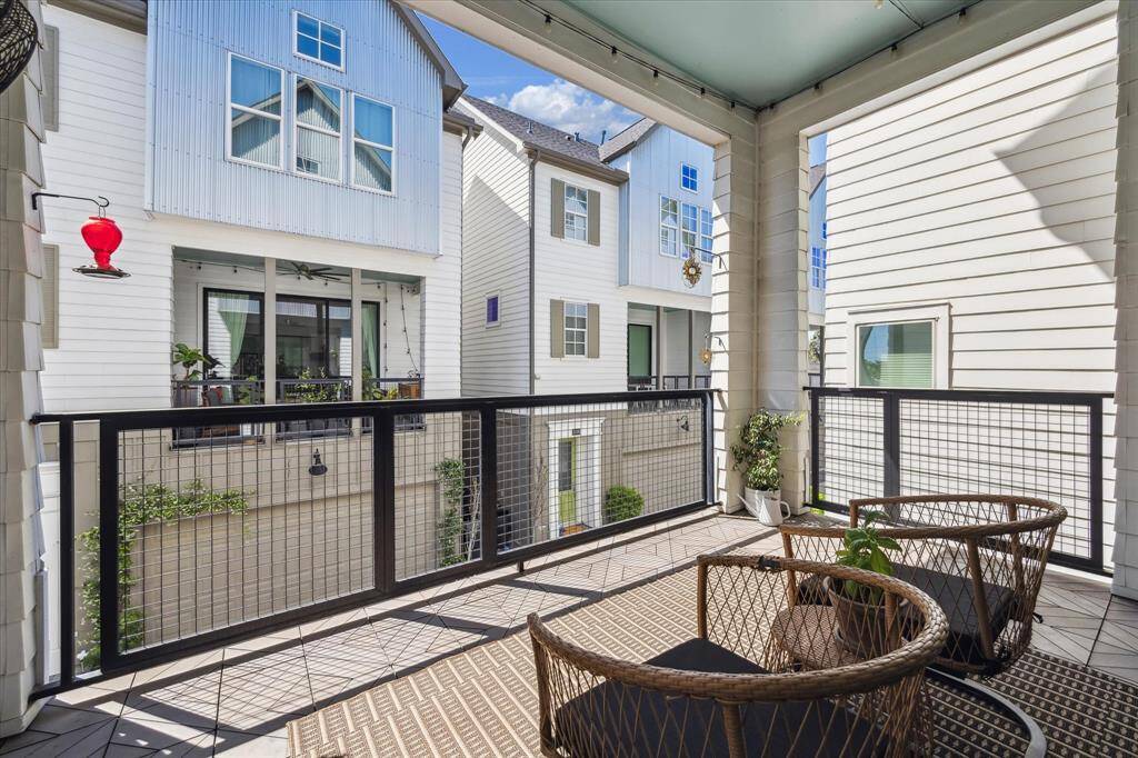 The spacious covered balcony offers plenty of room for outdoor seating, making it easy to relax and enjoy fresh air, sunshine, or a quiet moment under the shade.