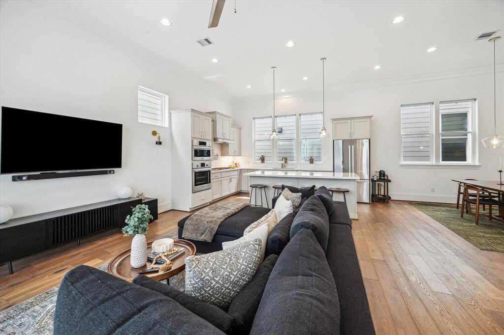 The open layout makes it easy to stay connected, with the spacious family room, dining area, and island kitchen all within earshot for effortless conversation and casual everyday living.