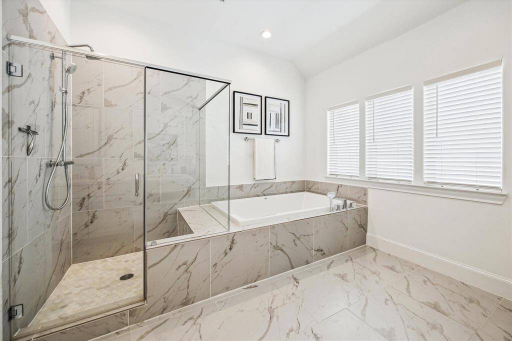 Relax and soak your worries away in this luxurious soaking tub or enjoy a quick rinse in the oversized walk-in shower. Either way, you're going to love this private retreat.