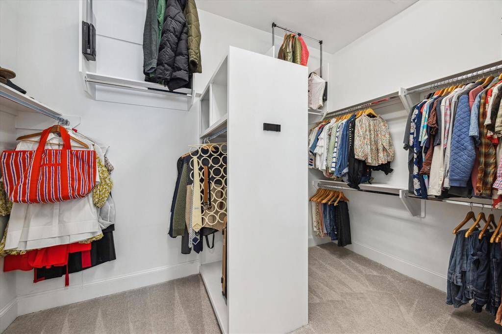 Shop ‘til you drop, this massive walk-in closet can handle it! With plenty of hanging space and built-in shelving for shoes, bags, and more, everything has a place in this well-organized space.