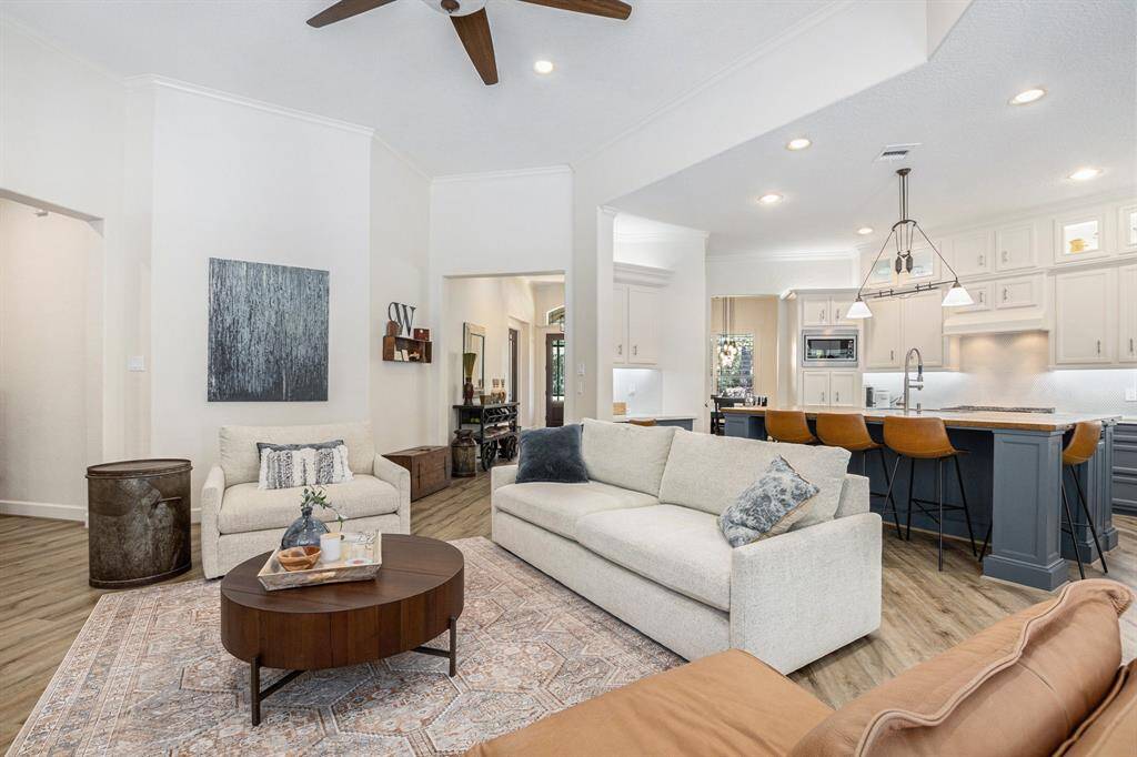 Additional view of this spectacular living room that seamlessly flows into the kitchen.