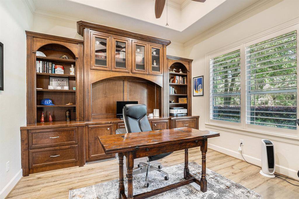 Spacious home office with stunning built-ins.