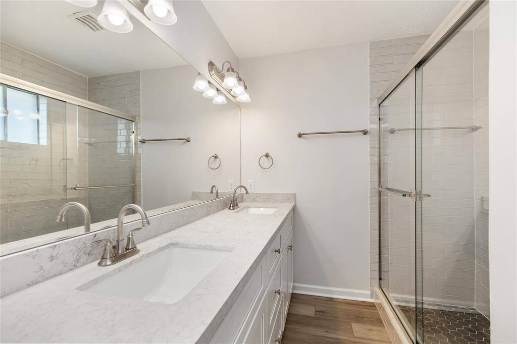The beautiful Primary Bathroom has an over-sized walk-in shower