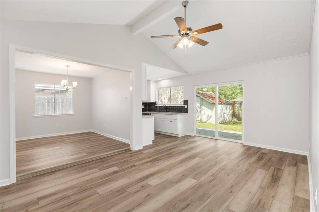 The generous Family Room exits to the backyard through the sliding door