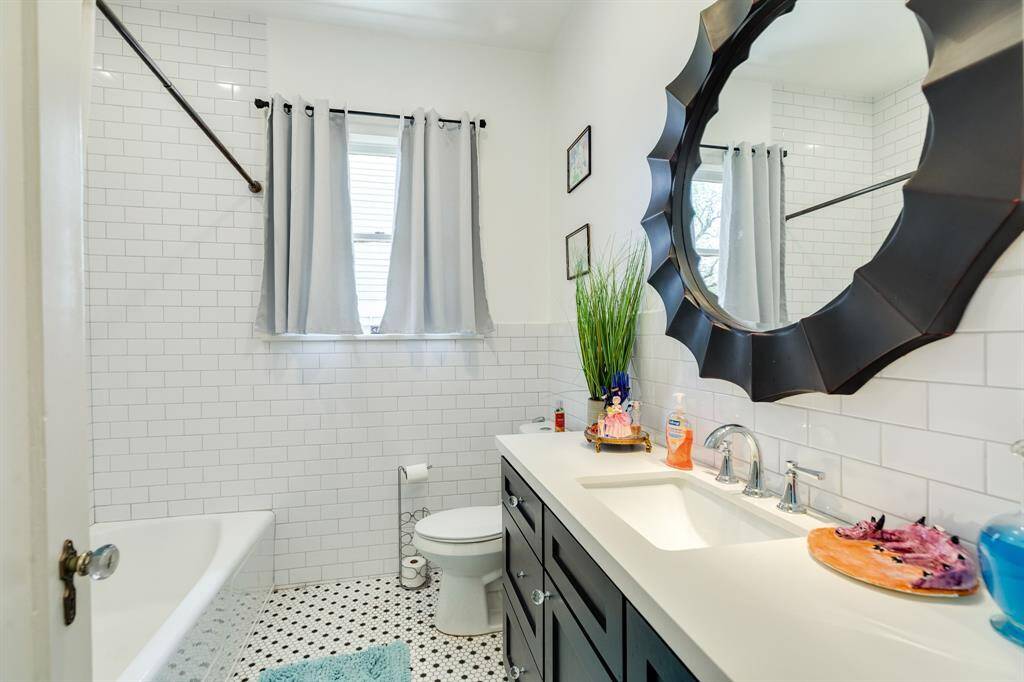 Hall bathroom has been tastefully remodeled.