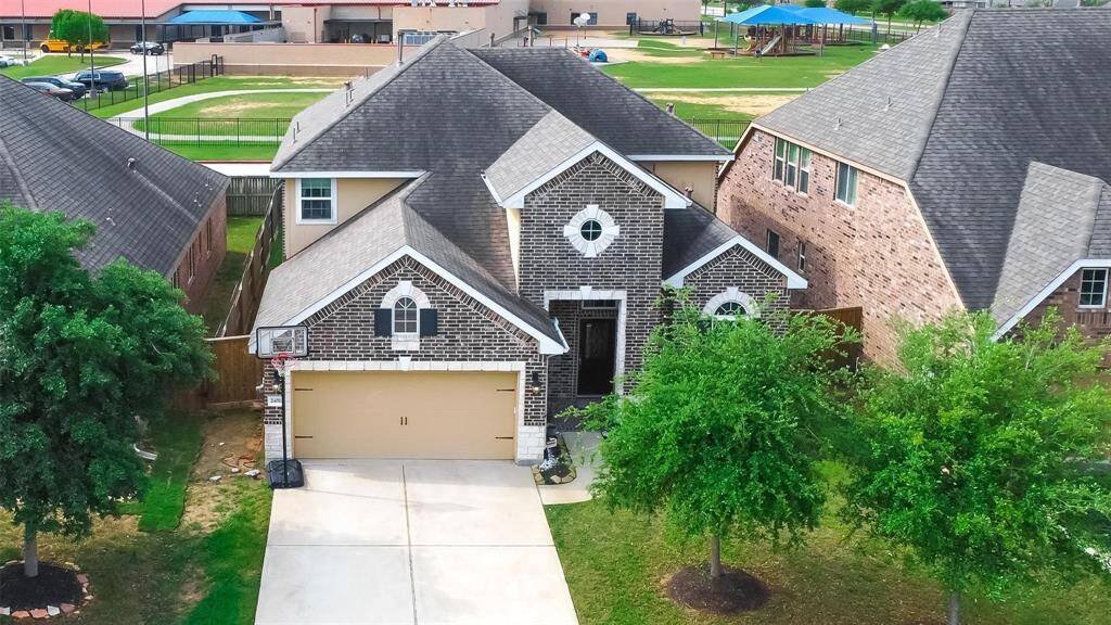 A covered front porch and decorative beveled glass front door will welcome you inside the foyer, where you will be greeted by lovely tile floors, and soaring ceilings with a custom chandelier.