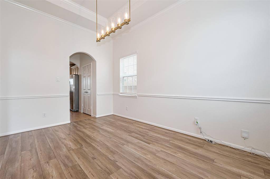 You have a formal dining with beautiful fixtures just entering the home.