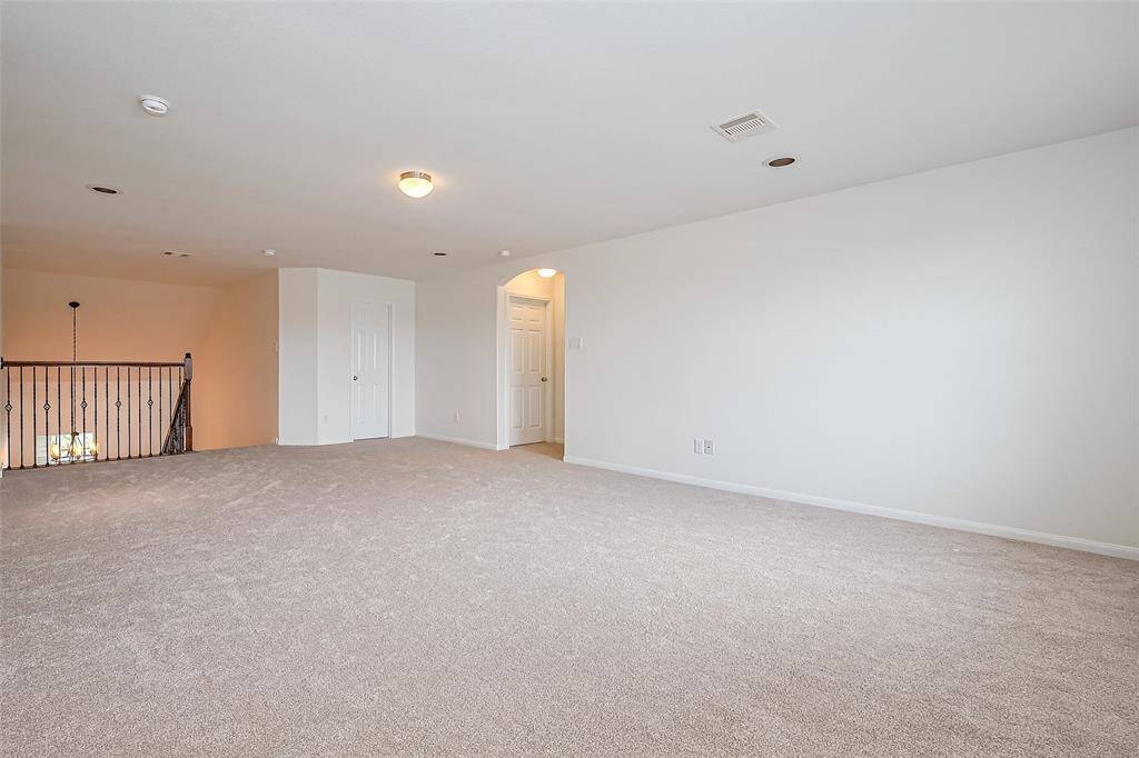 An ample game room awaits upstairs for the enjoyment of family and guests!