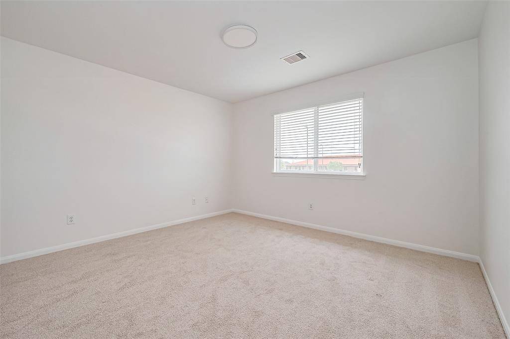 Step into luxury with this impeccable secondary bedroom, a canvas for your decorative skills.