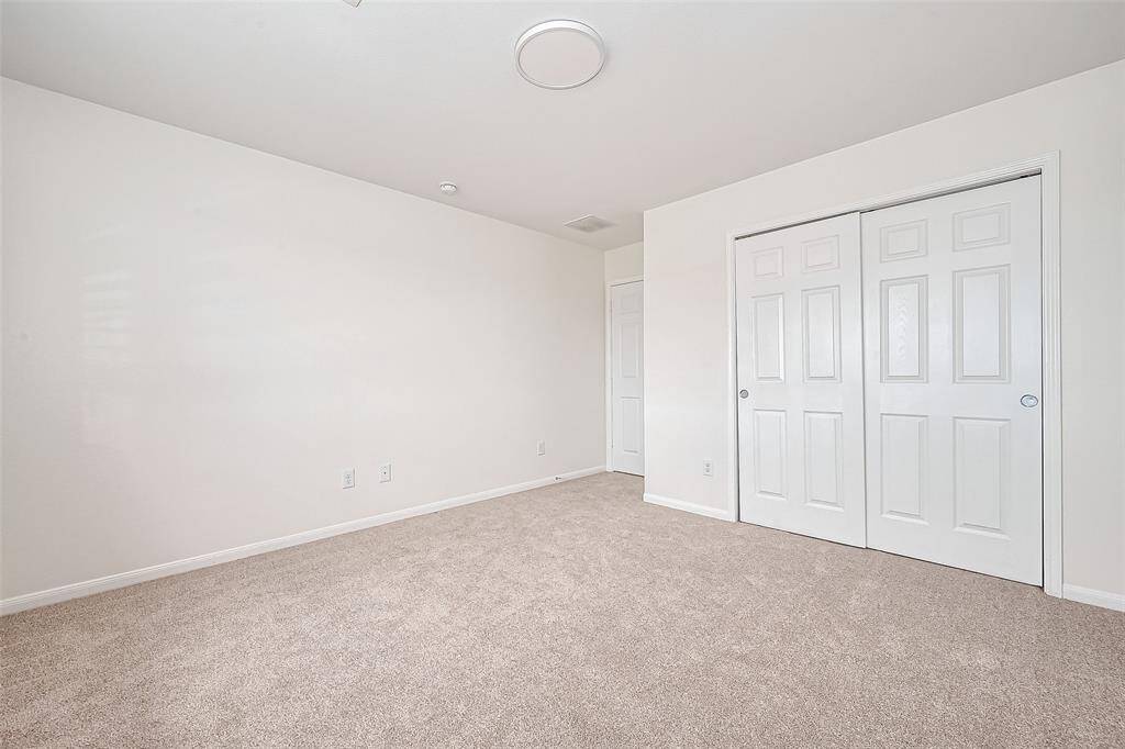 The spacious closet in this secondary bedroom, provides ample storage and organization for your wardrobe essentials.