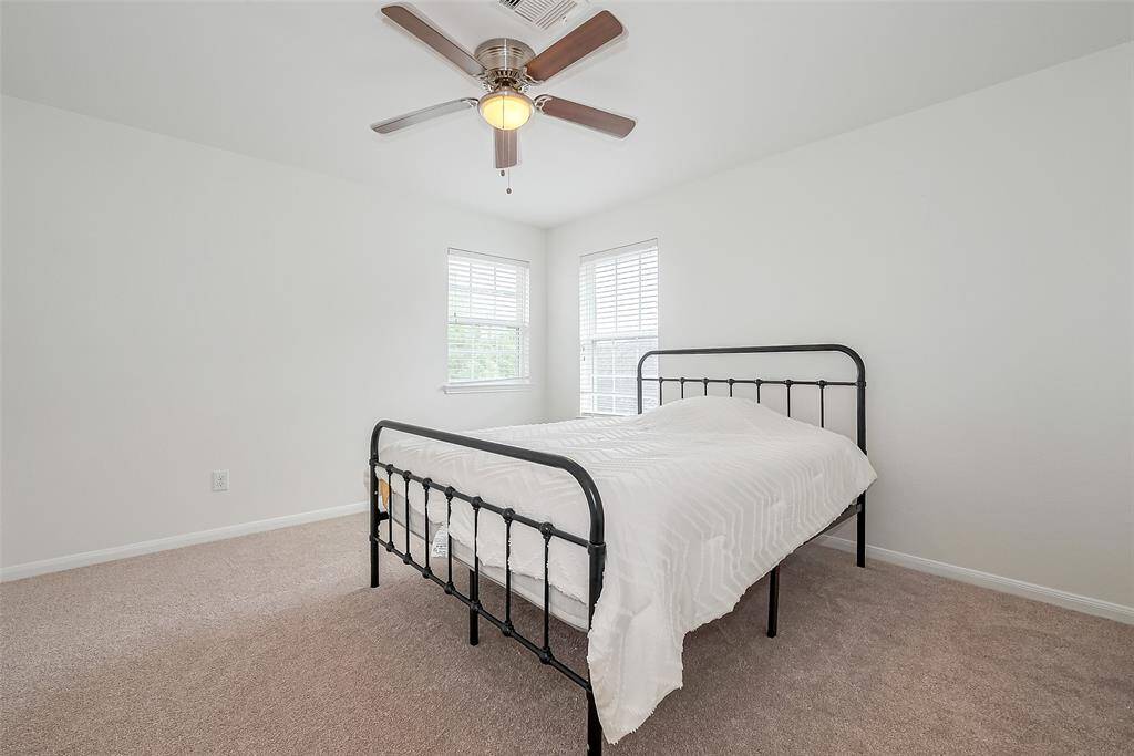 With ample space for a bed, and additional furnishings, this bedroom offers both comfort and functionality.