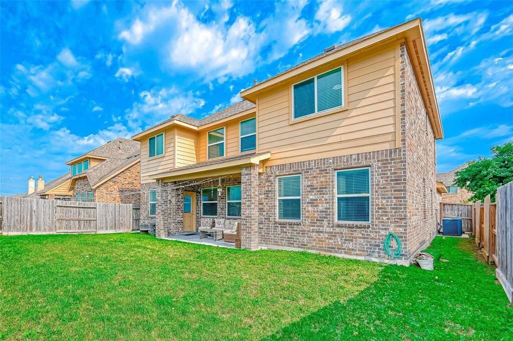 Step out back to a covered patio, where you can add your patio furniture and grill to create an amazing outdoor entertaining or alfresco dining space.