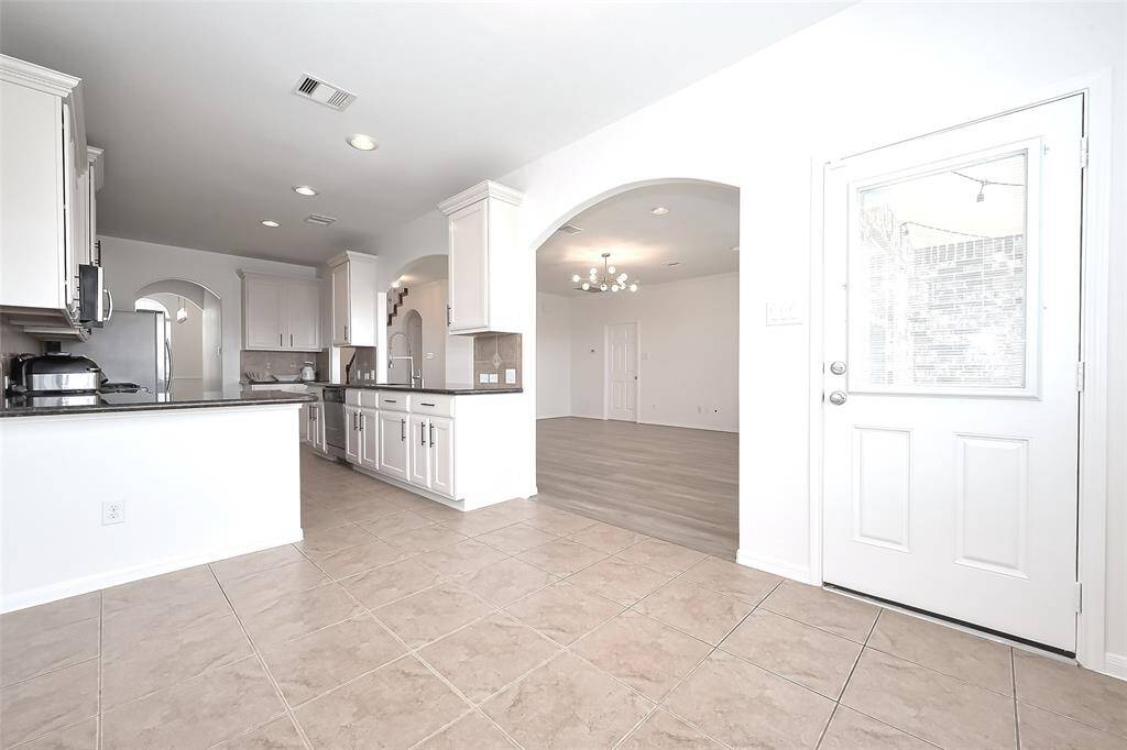 Just at the patio door you will have the nook for informal meals and easy access to the kitchen.