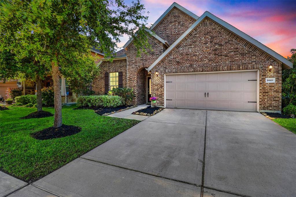Welcome home to this beautifully maintained Pulte Home, nestled on a quiet cul-de-sac street in the desirable King Crossing community. The brick exterior, arched entry, and charming shutters create a warm, inviting curb appeal, perfectly captured at twilight.