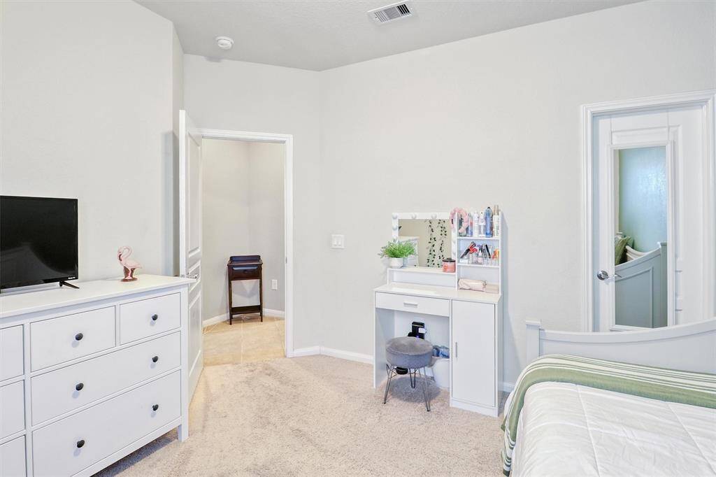 Ample space enhances this third bedroom’s functionality, while the walk-in closet adds everyday convenience. Whether used as a guest space or personal retreat, it’s thoughtfully designed to impress.