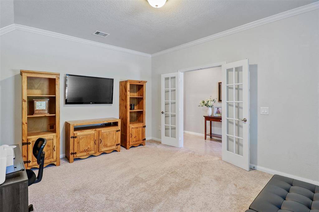 A large front-facing window fills the office with natural light, while the generous layout offers flexibility for desks, seating, or built-in shelving to suit your needs.