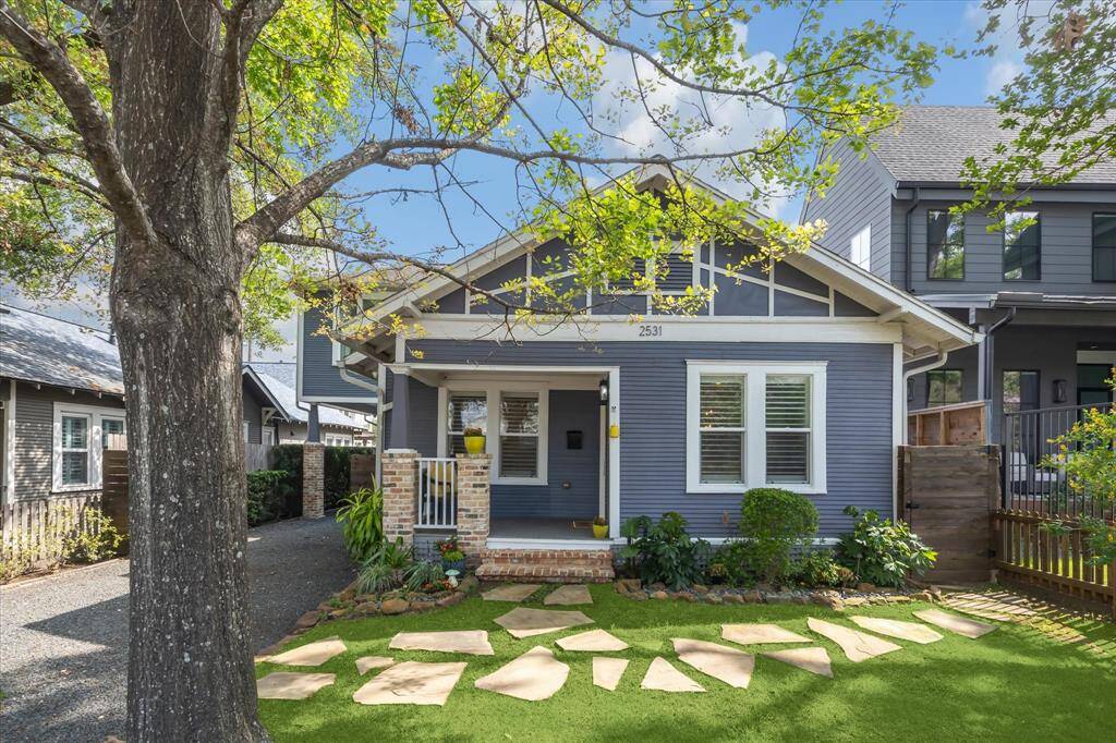 This beautifully maintained 3-bedroom, 2.5-bath residence features great curb appeal, complete with a cheerful yellow door and lush, landscaped front yard.