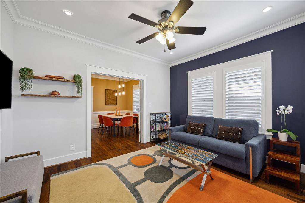 From the living room, enjoy a seamless flow into the vibrant dining area. Bold accent walls and playful pops of color bring modern flair to this cozy yet stylish space.