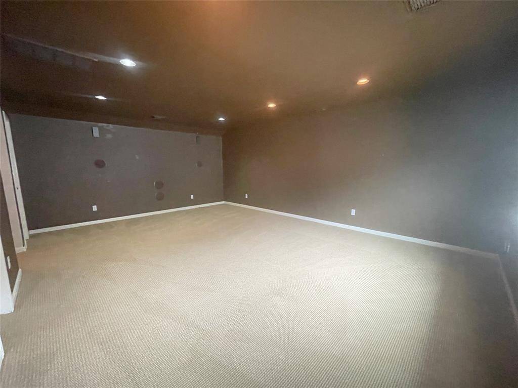 Upstairs media room with bathroom