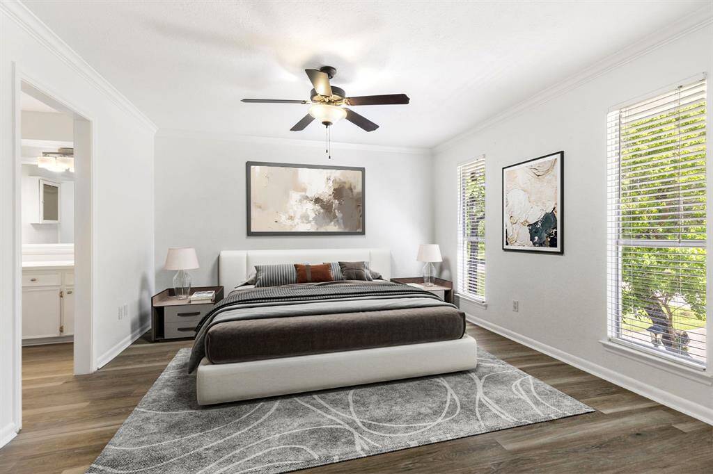 The primary bedroom is located to the left of the balcony and boasts gorgeous natural light and ample space!