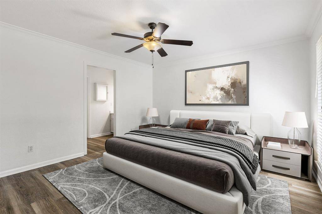 The primary bedroom is located to the left of the balcony and boasts gorgeous natural light and ample space!