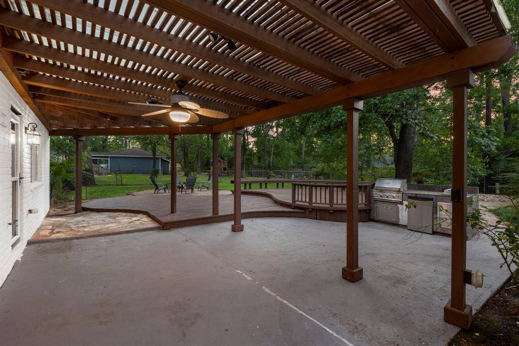 Enjoy evenings in the backyard under the covered patio that looks out towards the massive yard!