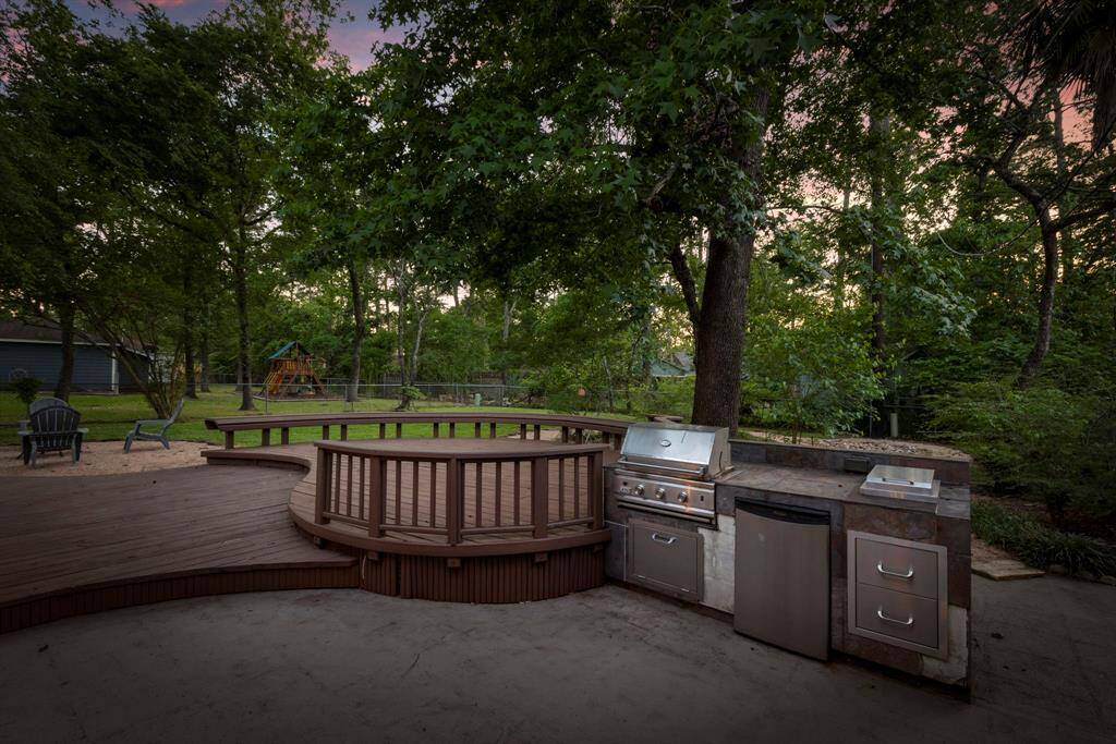 Add additional seating or install a hot tub in this updated deck near the outdoor kitchen.
