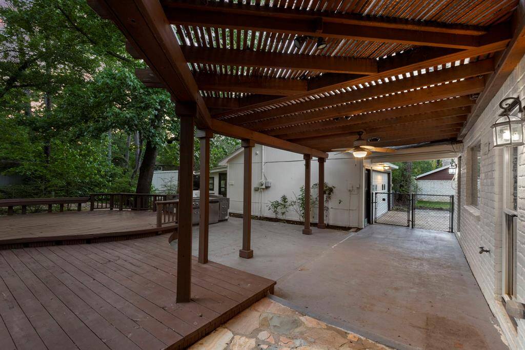 Enjoy evenings in the backyard under the covered patio that looks out towards the massive yard!