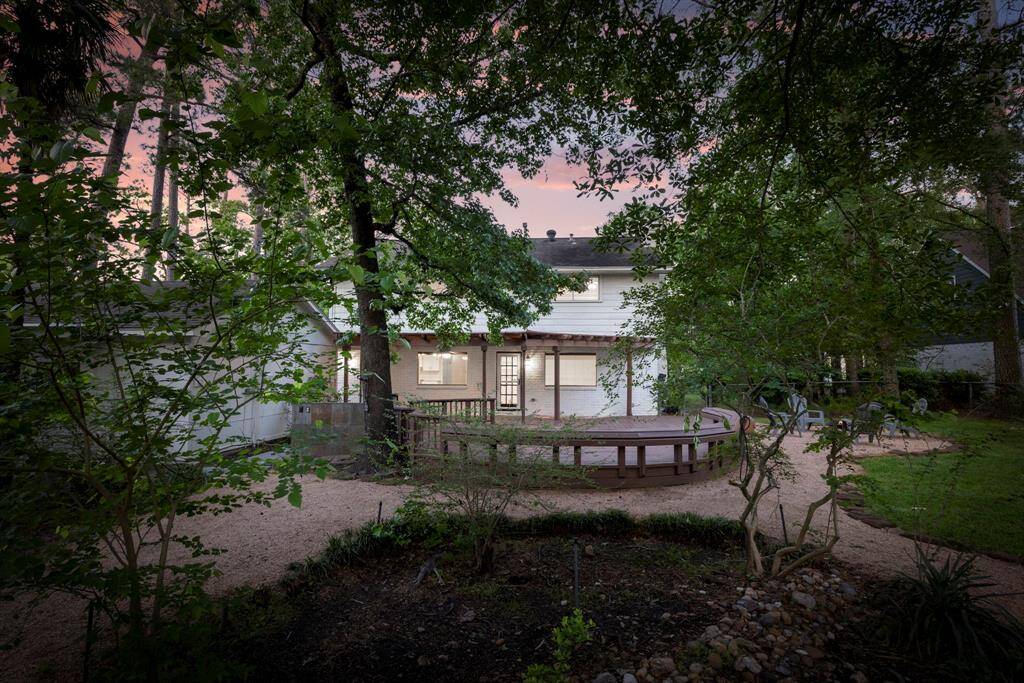 The back yard features gorgeous trees that gives you shade and privacy.