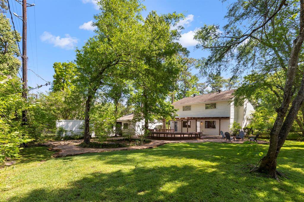 The back yard features gorgeous trees that gives you shade and privacy.