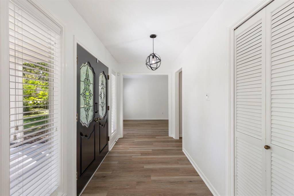The double door entry offers an impressive entrance that leads to the dining room and formal living space.