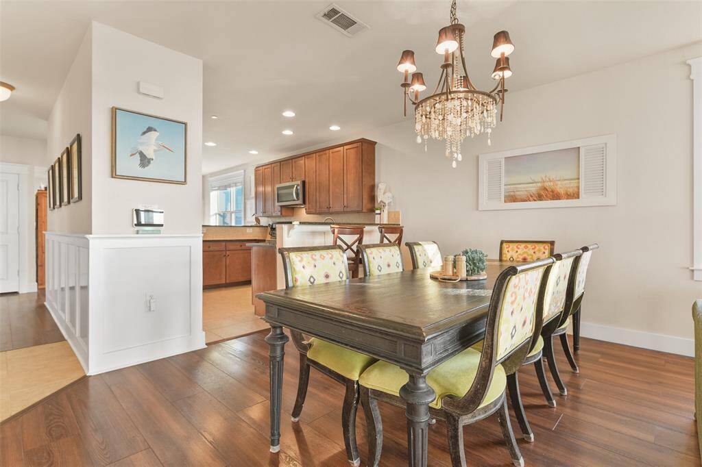 Back inside, we notice block wainscoting between the entry hallway and the dining area. Imagine the memories to be created here.