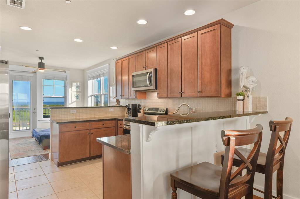 From this showstopper kitchen, you will have Gulf views to the South while Bay views to the North. No other floorplan here offers this. Breakfast bar seating allows for you to entertain to your heart's content.