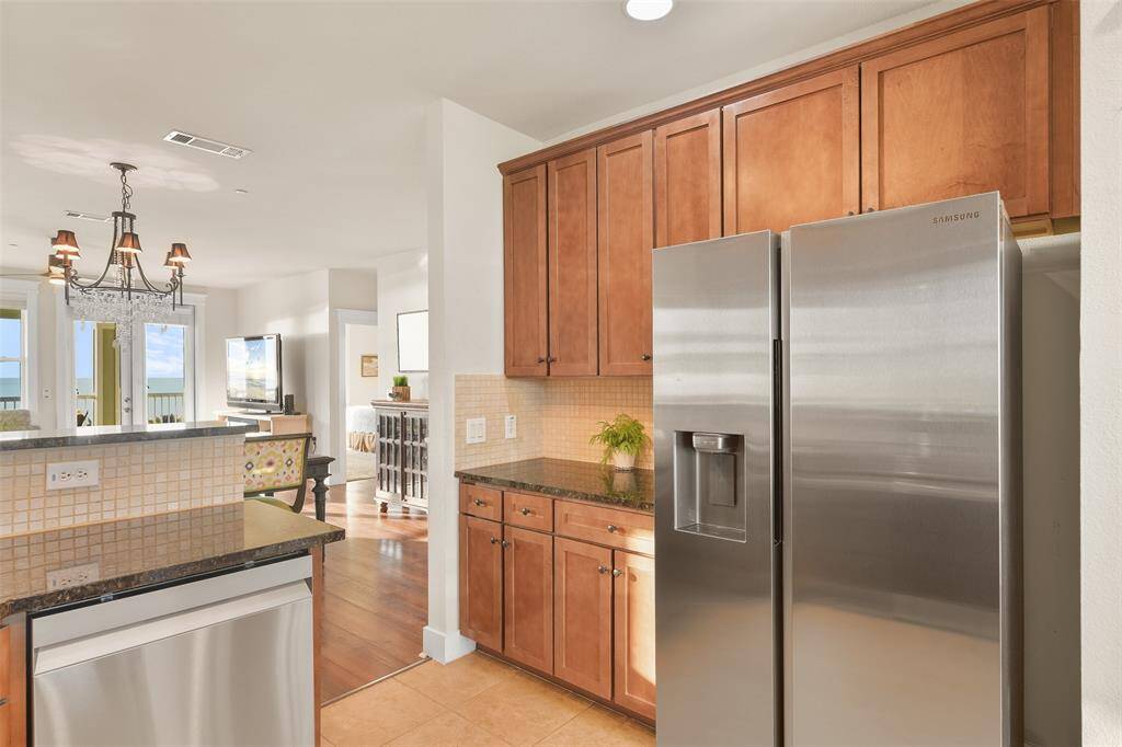 Even more maple cabinetry is found on the opposite side of the kitchen. There is no shortage of storage! Also one more look at the fabulous North views from the kitchen.