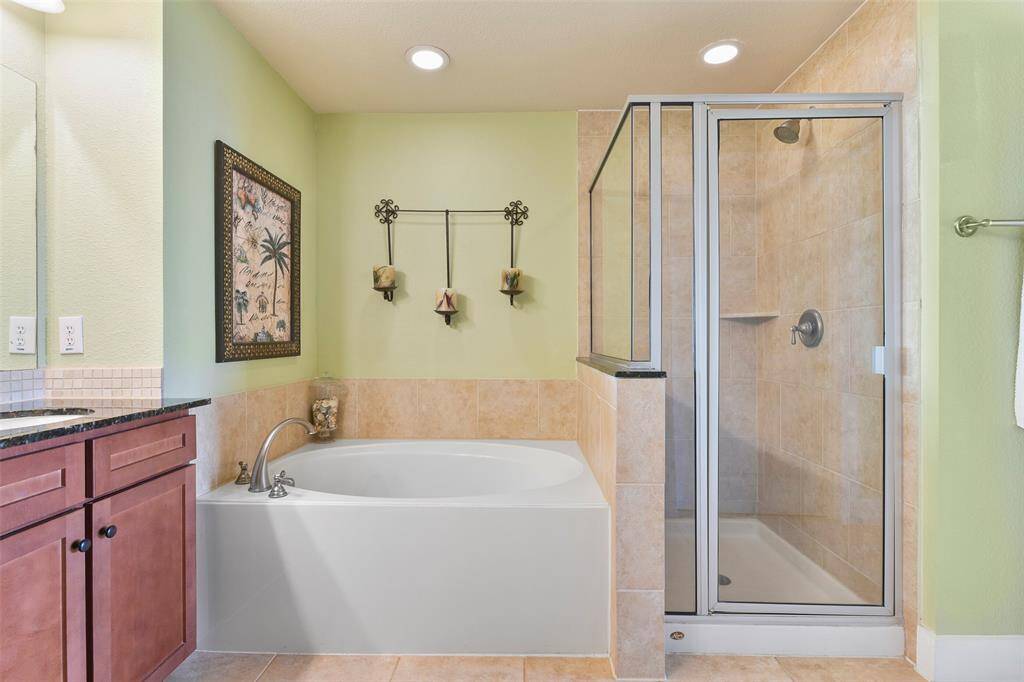 Soak your worries away in the garden tub or enjoy the convenience of the tiled walk-in shower.