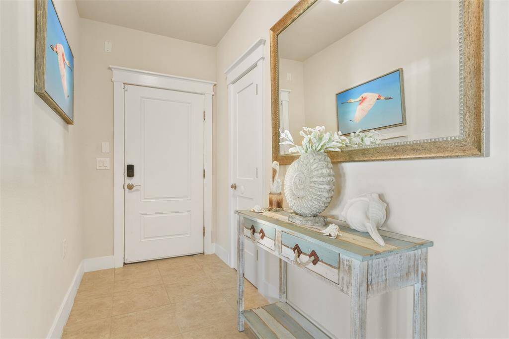The coastal-appointed entryway. An entry closet is found to the Right. Let's go explore the multitude of amenities!